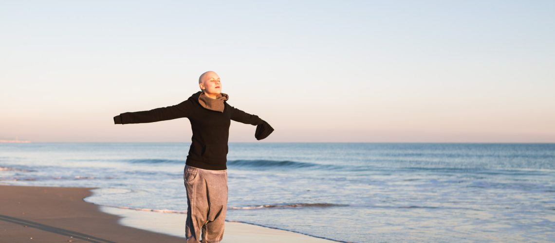 Real Female hairless fight against cancer at the beach